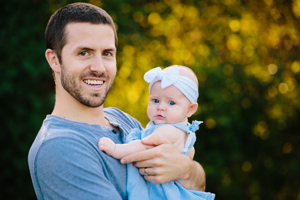 dad holding baby girl at garnsey park