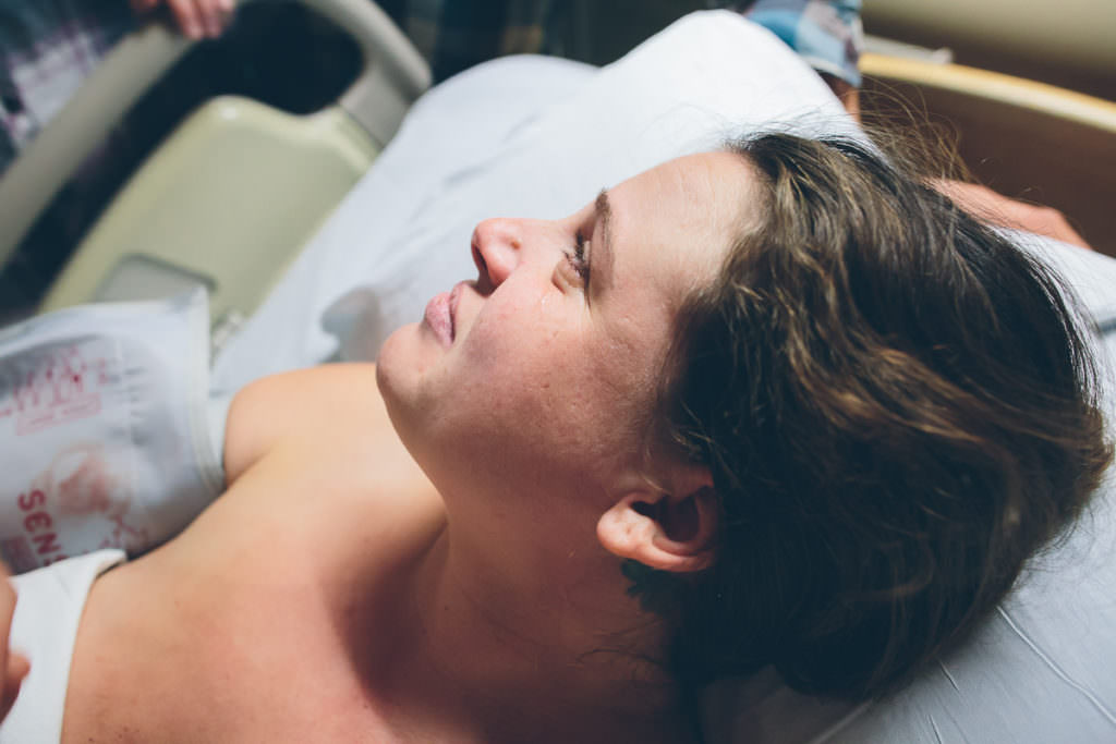 mom looking up with a tear in her eye