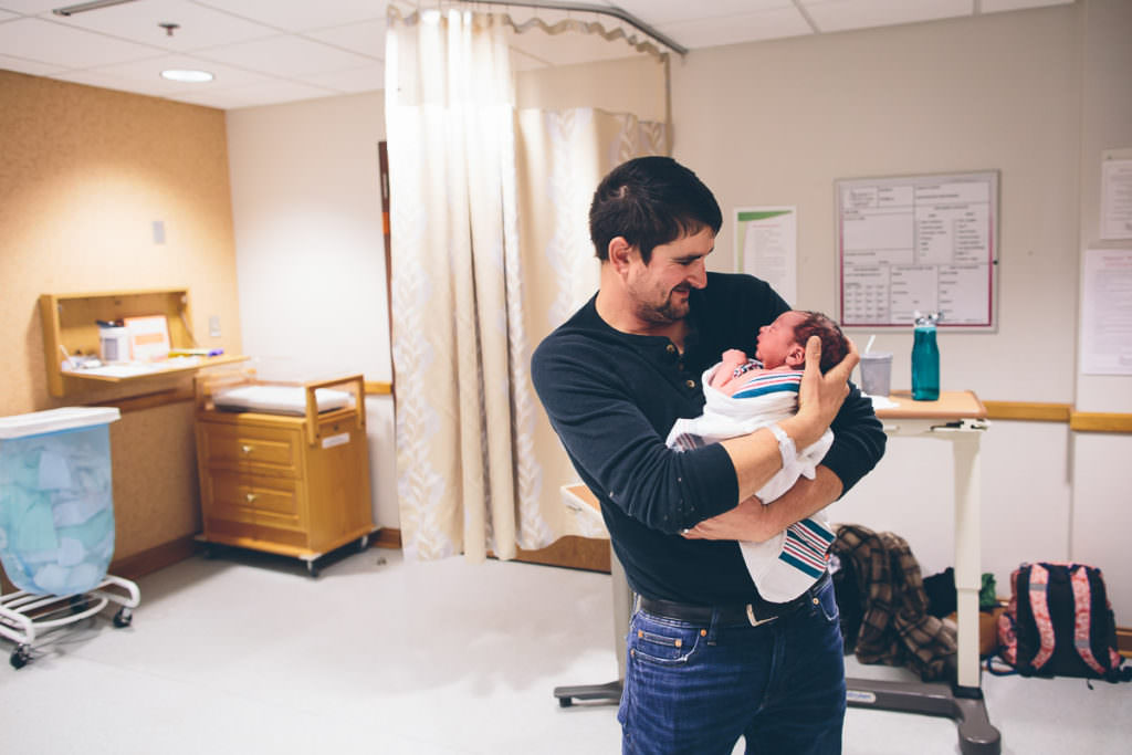 Dad holds newborn baby boy at Burdett Birth Center