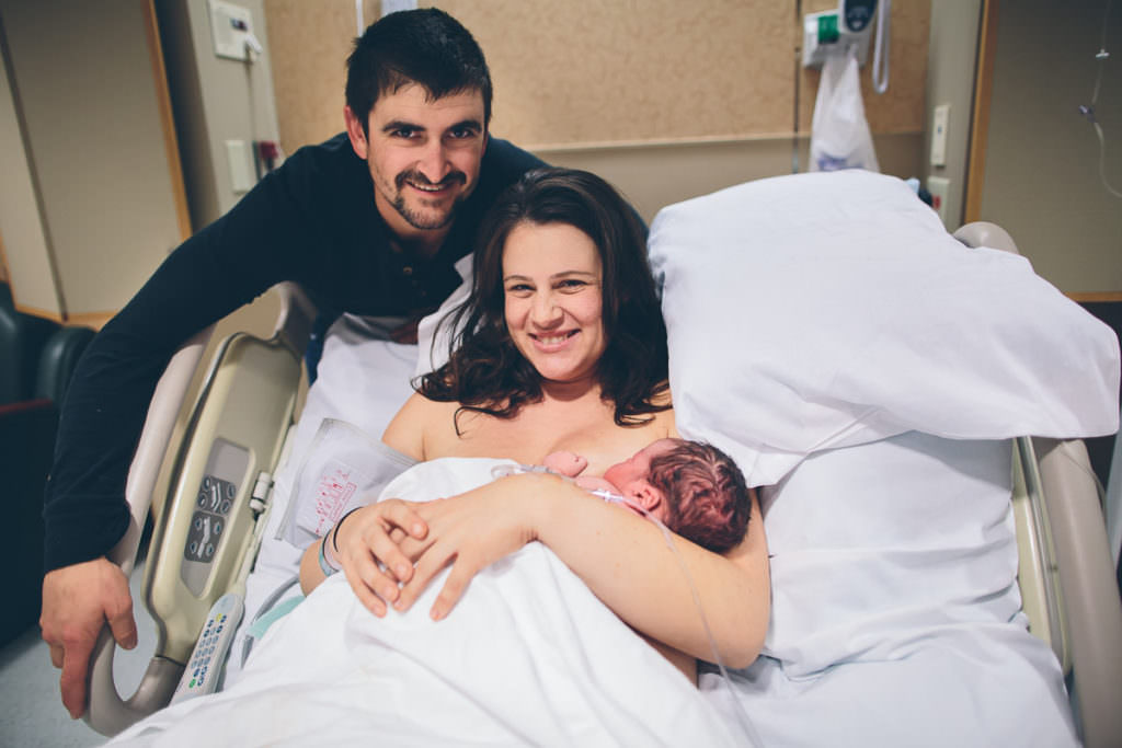 mom dad and newborn boy an hour after baby was born in Troy New York