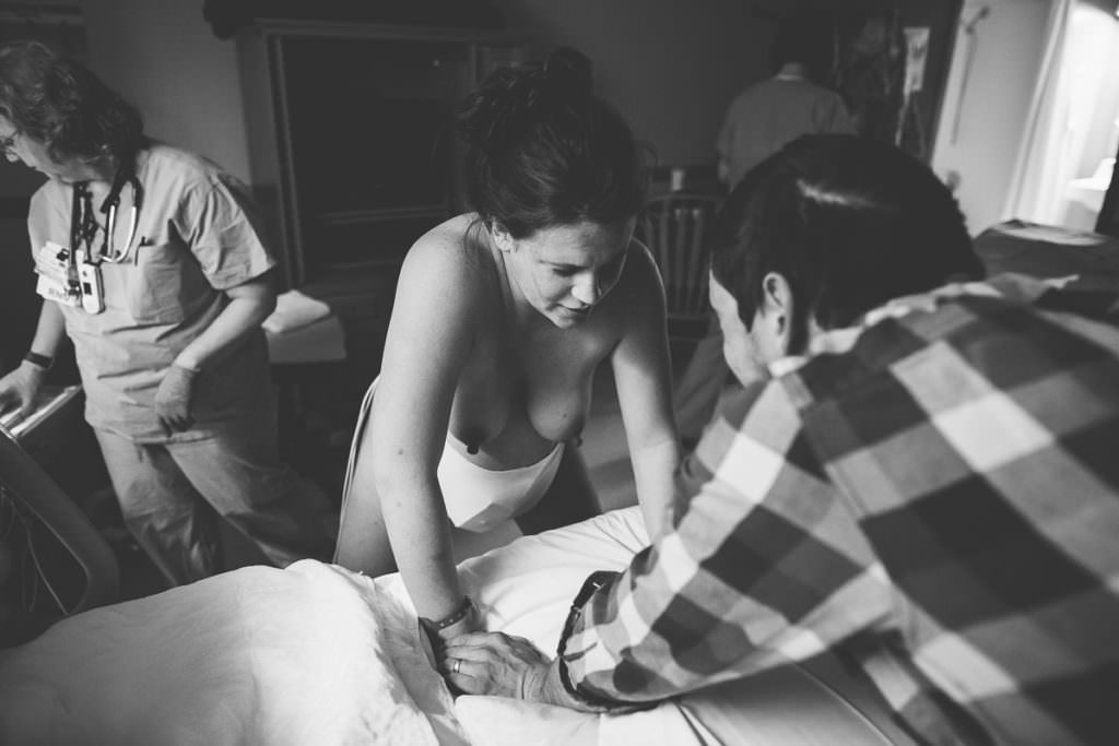 mom gearing up for a contraction at 9.5 cm dilated and no drugs