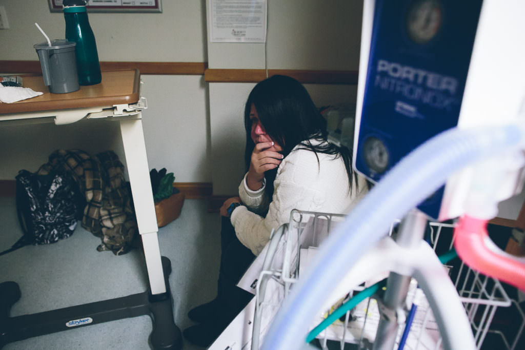 birth clients mom watching and waiting nervously in the corner