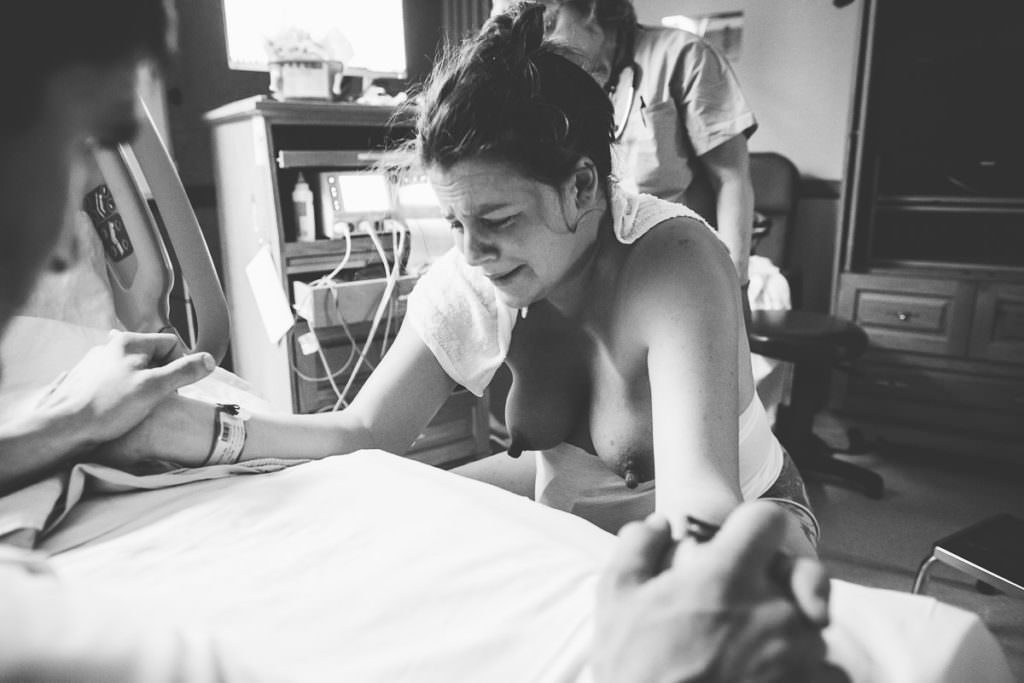 mom starts to cry from pain of childbirth at burdett hospital