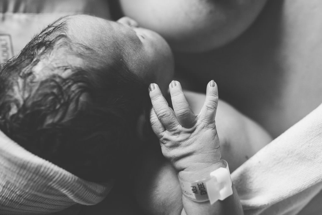 black and white image newborn baby fingers