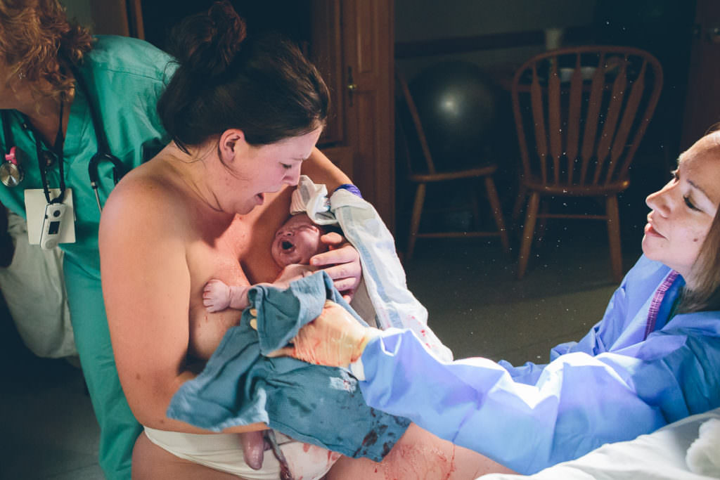 mom holding her baby she just delivered on a birthing stool at Burdette Birth Center in Troy NY