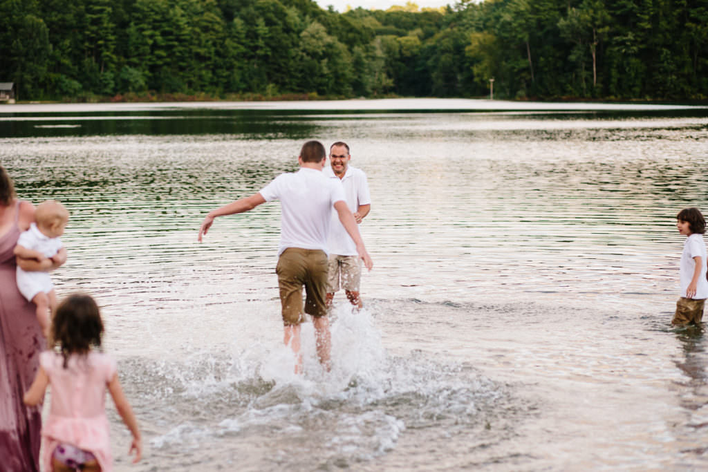 teenage son chases father through lake fully clothed