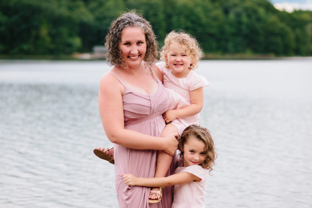 mom holding her two daughters in new york
