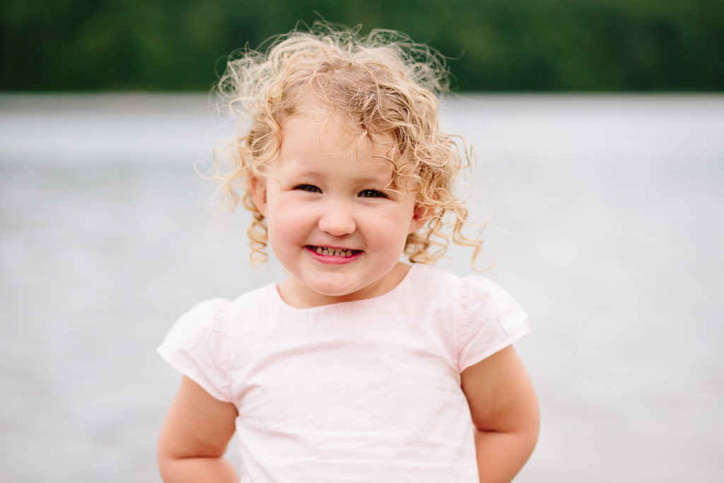 girls in pink dress and curly blond hair in new york