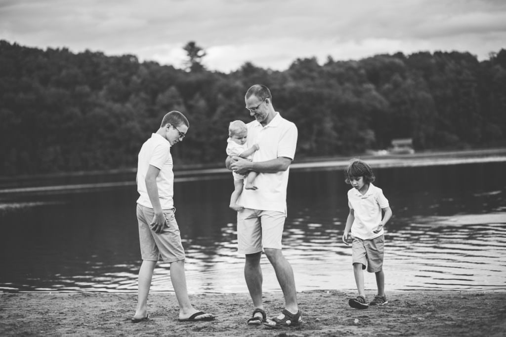 father talking to his three sons at moreau lake state park