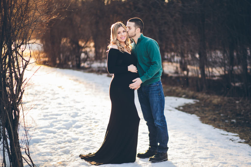 husband kissing pregnant wife cheek Clifton Park Maternity Photographer