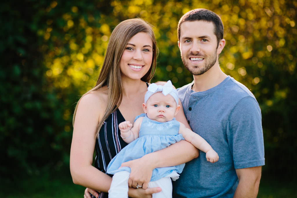 mom and dad holding baby girl Albany NY baby photographer