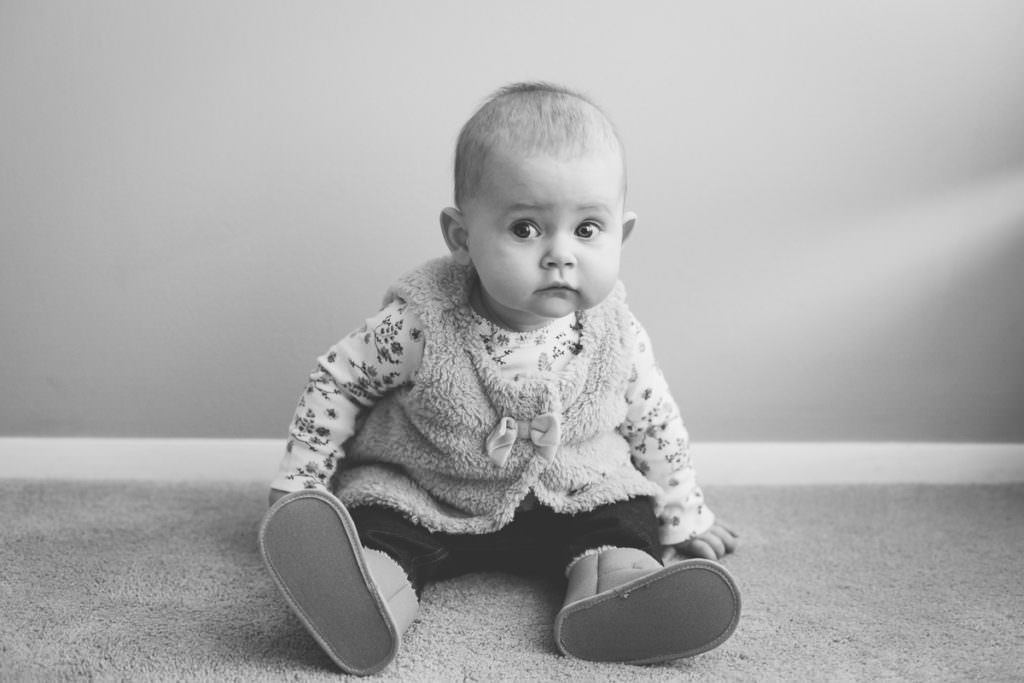 black and white photography baby girl sitting in home Albany NY photographer