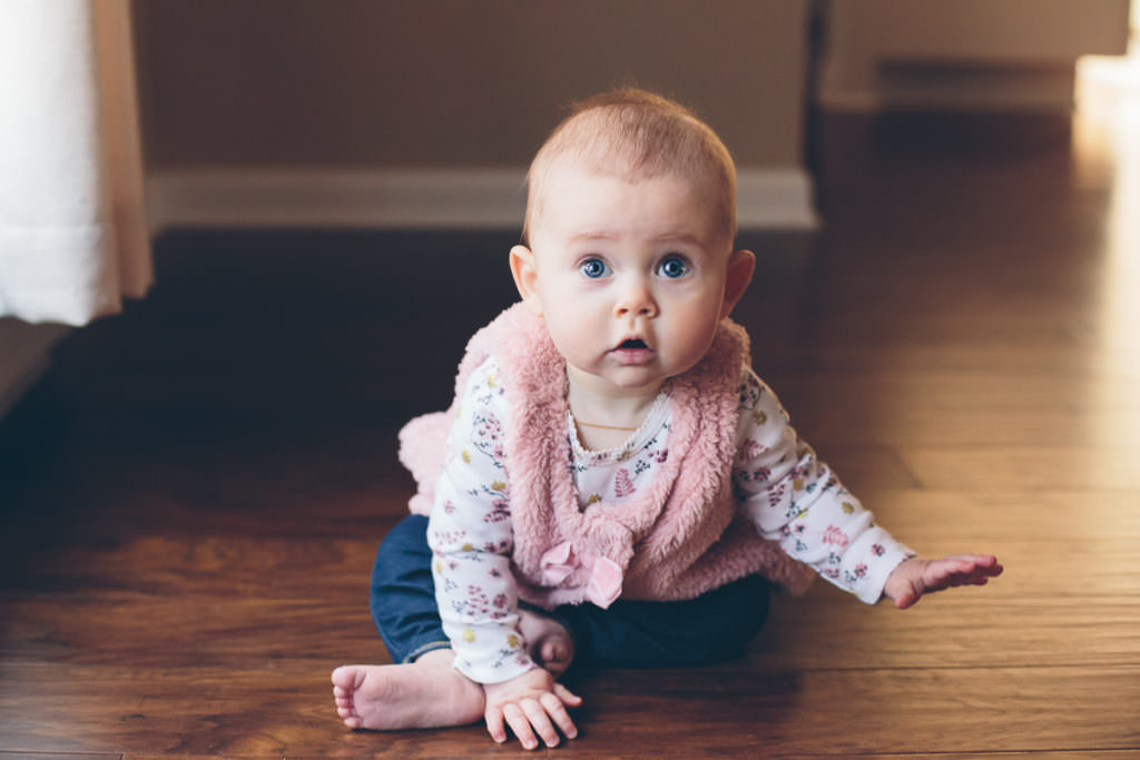 baby sitting on hard wood floor in home lifestyle photography Clifton park NY