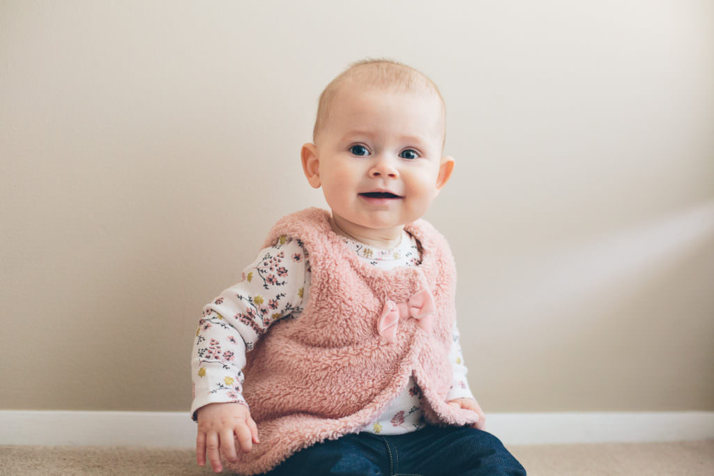 Lifestyle family photographer in Clifton Park New york baby girl sitting