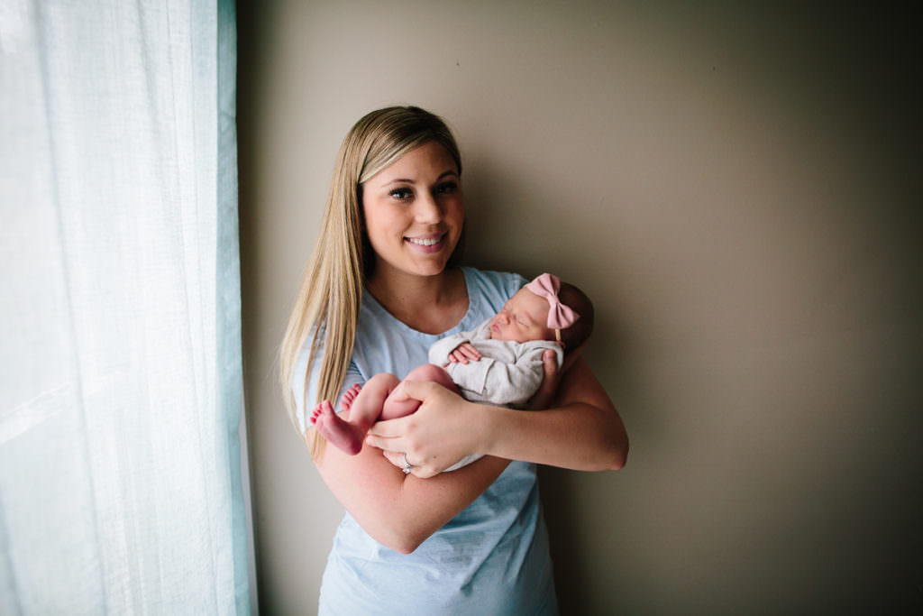 New York Capital Region lifestyle newborn photographer mom holding baby girl
