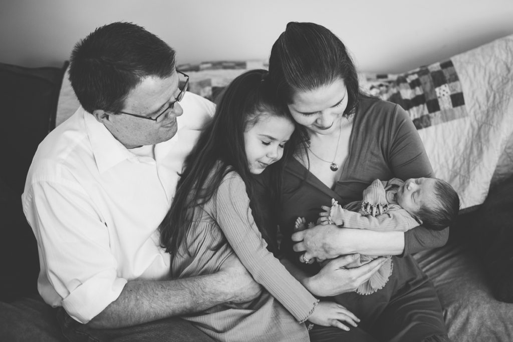 family of four snuggled up in latham N