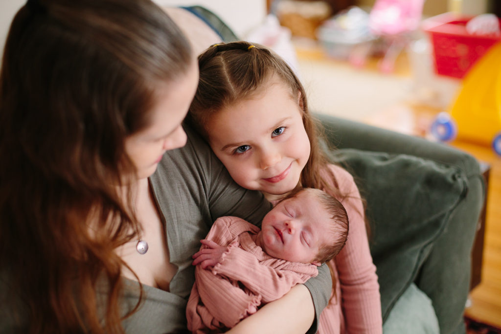 lifestyle newborn photography baby with big sister