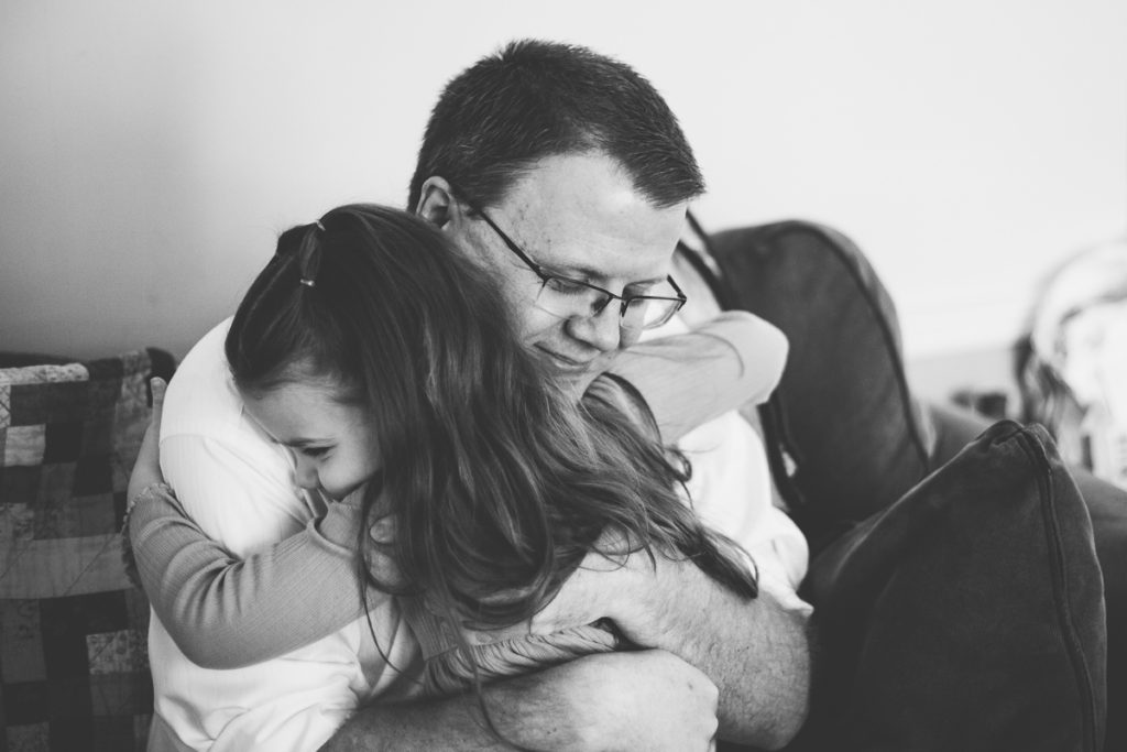 daughter giving dad a hug