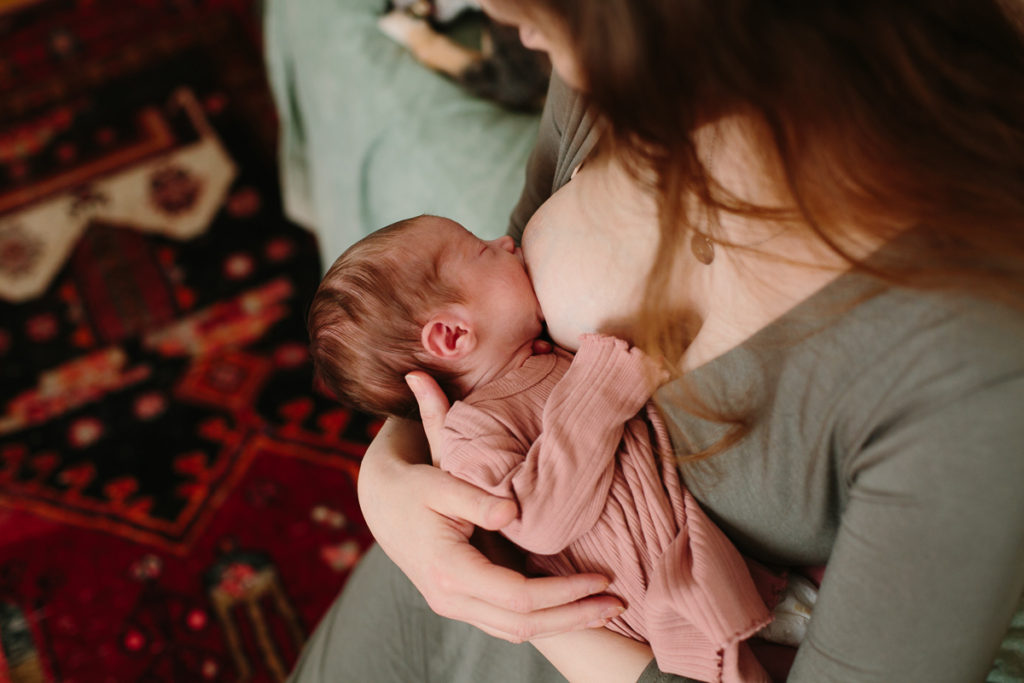 newborn baby girl nursing