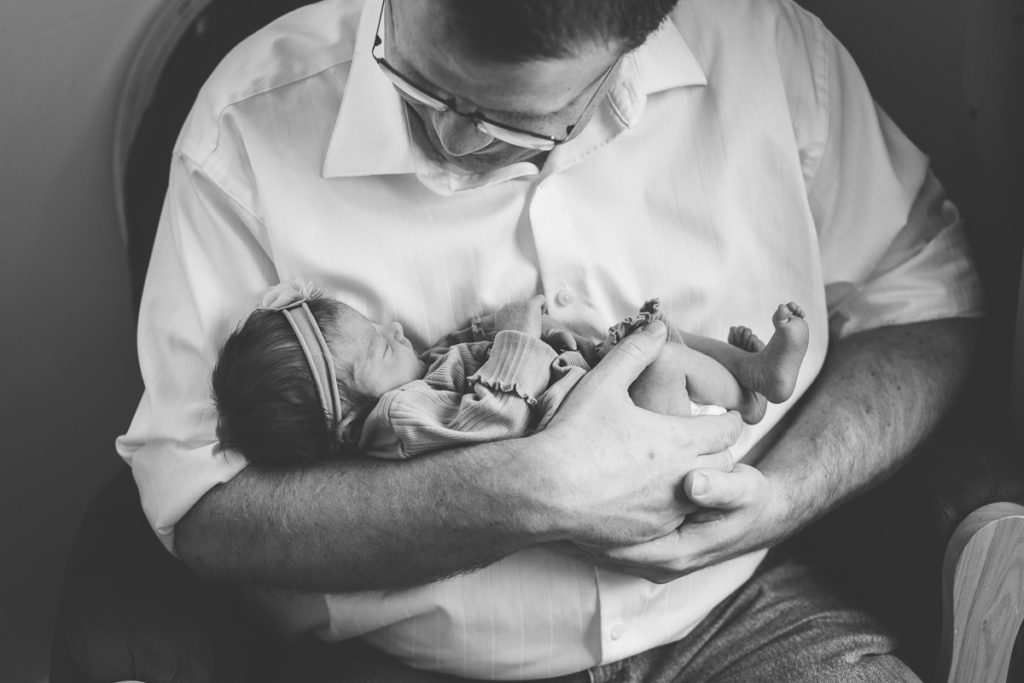 clifton park ny dad holding newborn baby girl