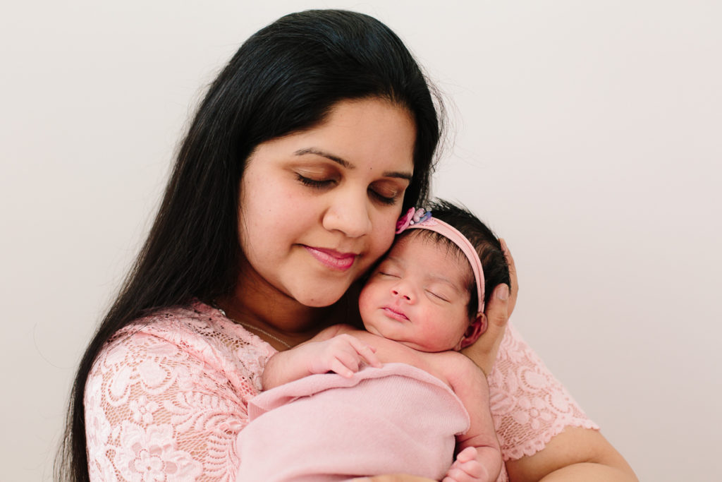 mom holding her newborn baby girl Clifton Park NY newborn photography