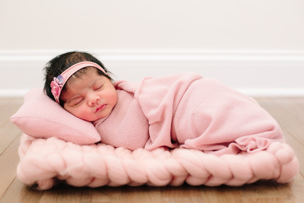 newborn baby girl during home lifestyle newborn photography session