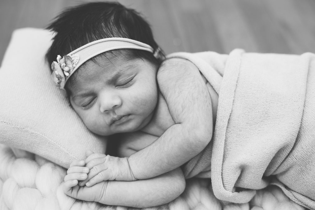 newborn baby girl sleeping black and white photography