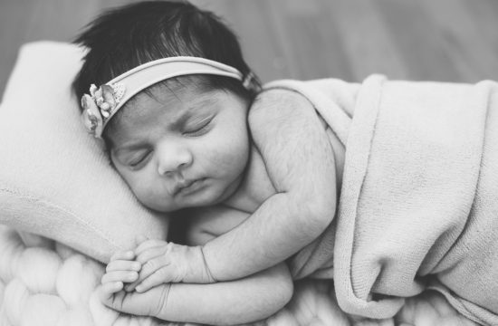 newborn baby girl sleeping black and white photography