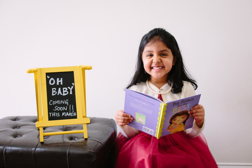 oh baby sign with big sister waiting for new baby