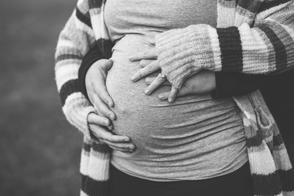 mom and dad hands on pregnant belly maternity photographer New York