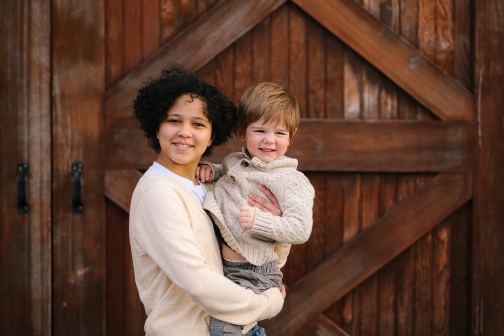 Sister holding toddler brother in Halfmoon New York Photographer