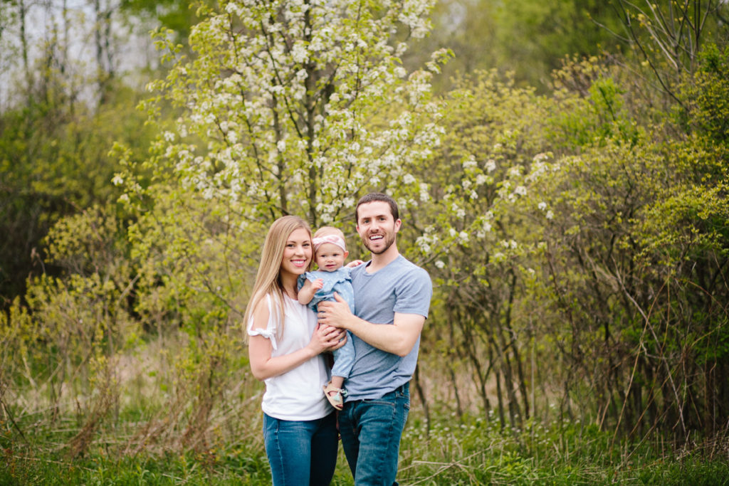 Family standing in front of flowering tree Saratoga NY 