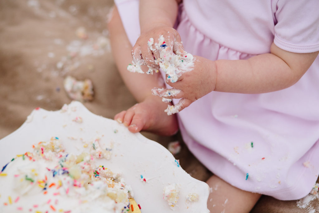 messy hands and feet after cake smash saratoga ny