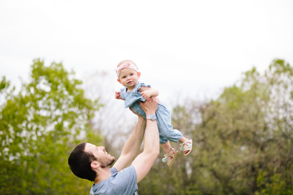 dad holding baby in air Saratoga NY baby photography