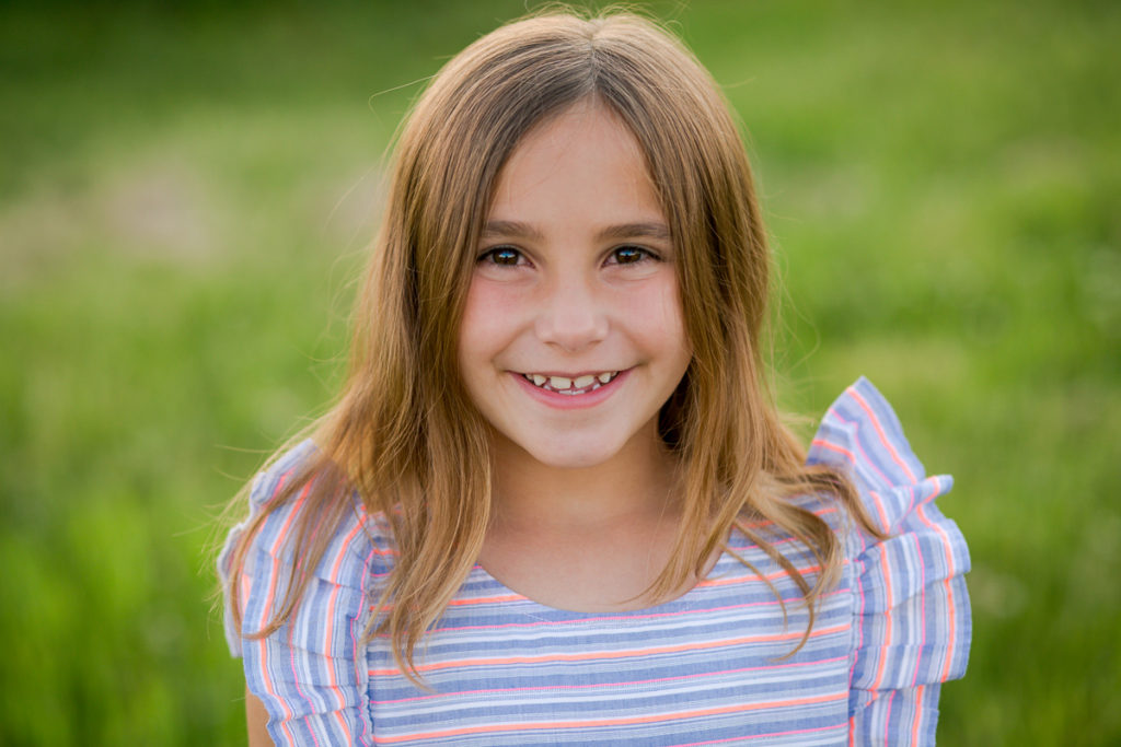 portrait of young girl with brown hair and eyes