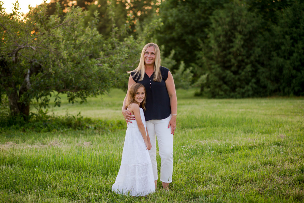 Mom with daughter in white dress in Clifton Park NY