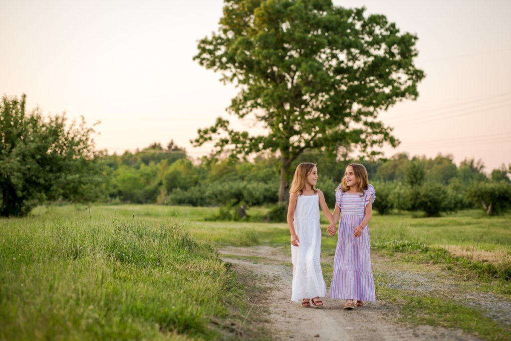 twin girls walking through an apple orchard clifton Park NY