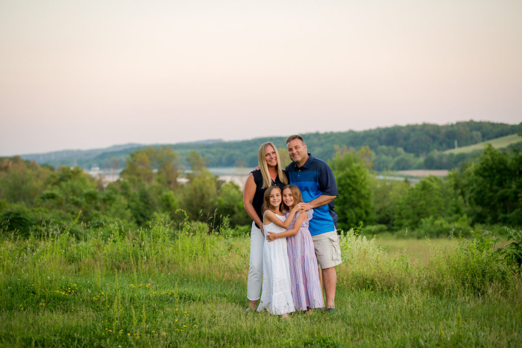family of four standing near mohawk river clifton park ny