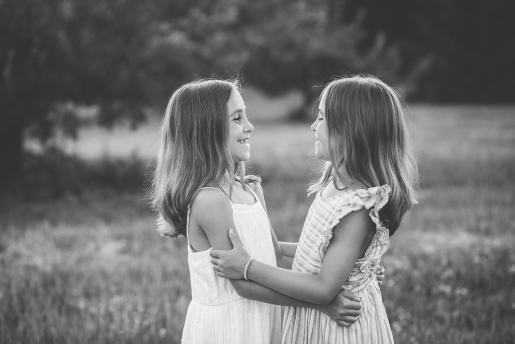 twin girls laughing at each other clifton park new york