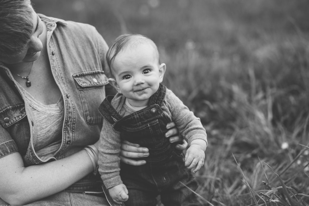 baby boy in overalls black and white