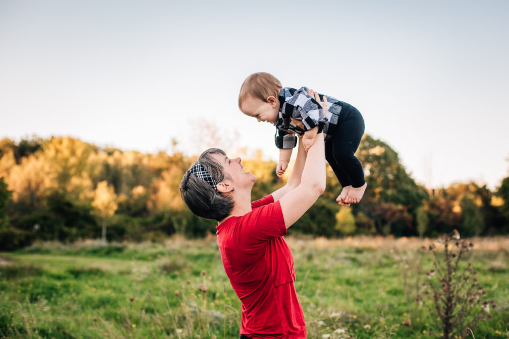 mom holding baby in airplane clifton park ny baby photographer