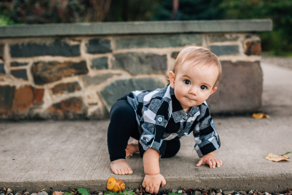 baby boy crawling on cement at Garnsey Park NY