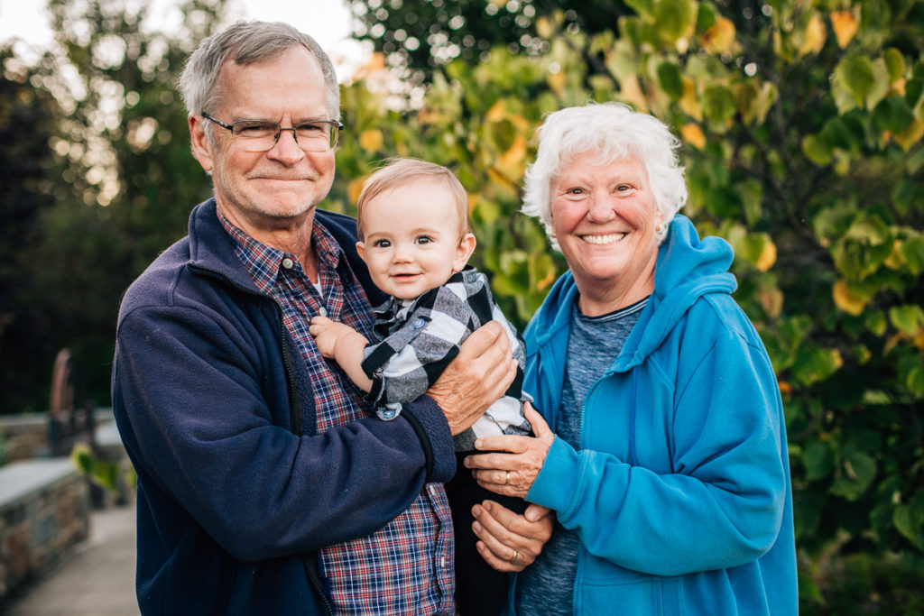 grandparents holding baby boy