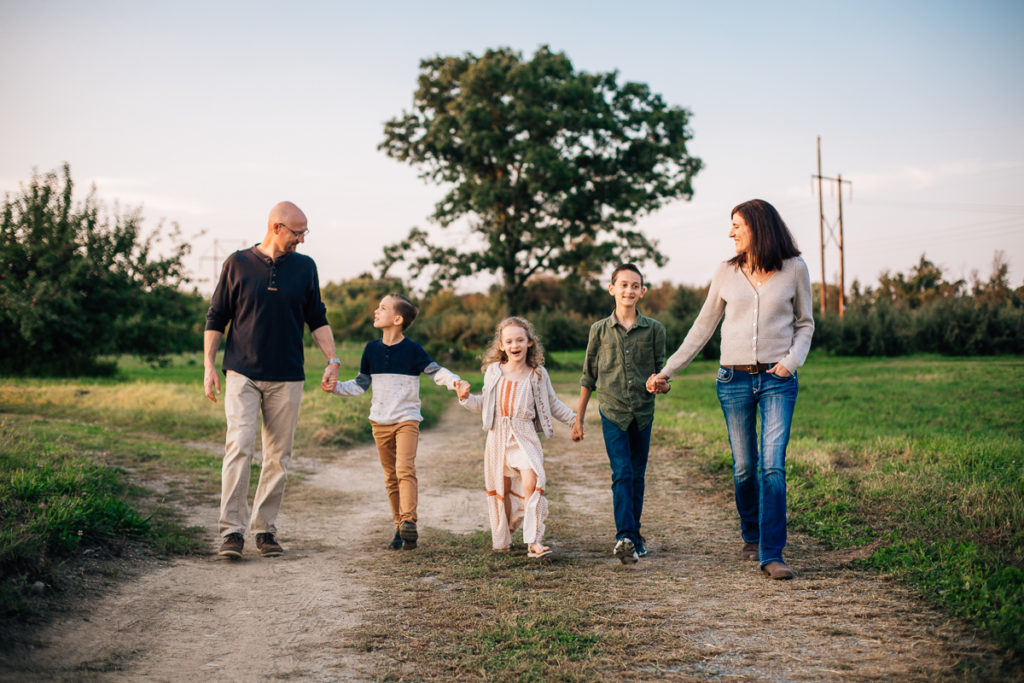 family walking on a path at Riverview Orchards Clifton Park NY