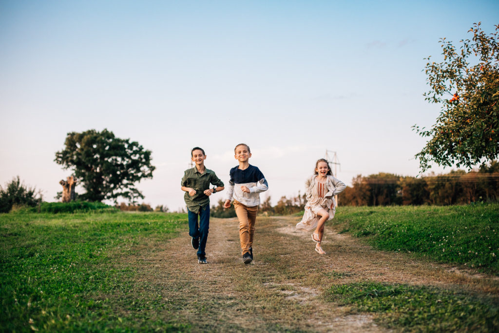 three kids running on a path Clifton park NY