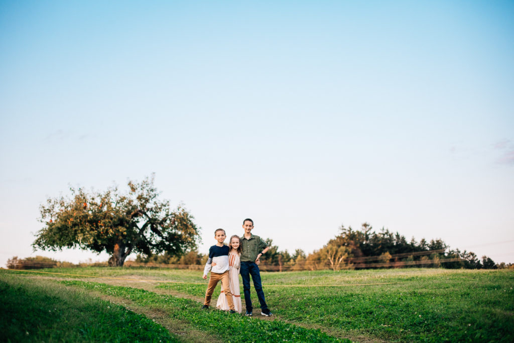 three kids standing in open field Clifton Park NY photography