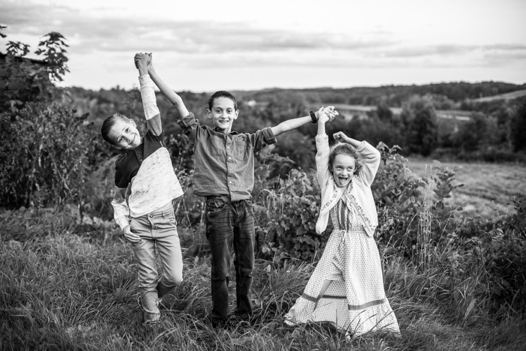 three siblings being silly