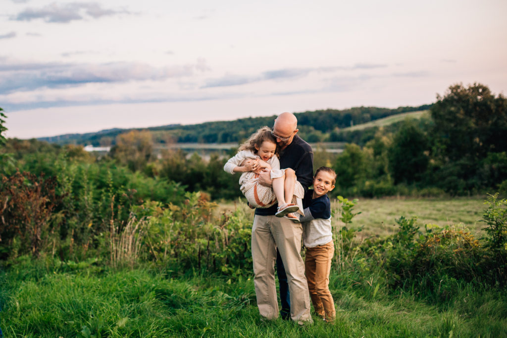 dad playing with his kids Clifton park Family Photography