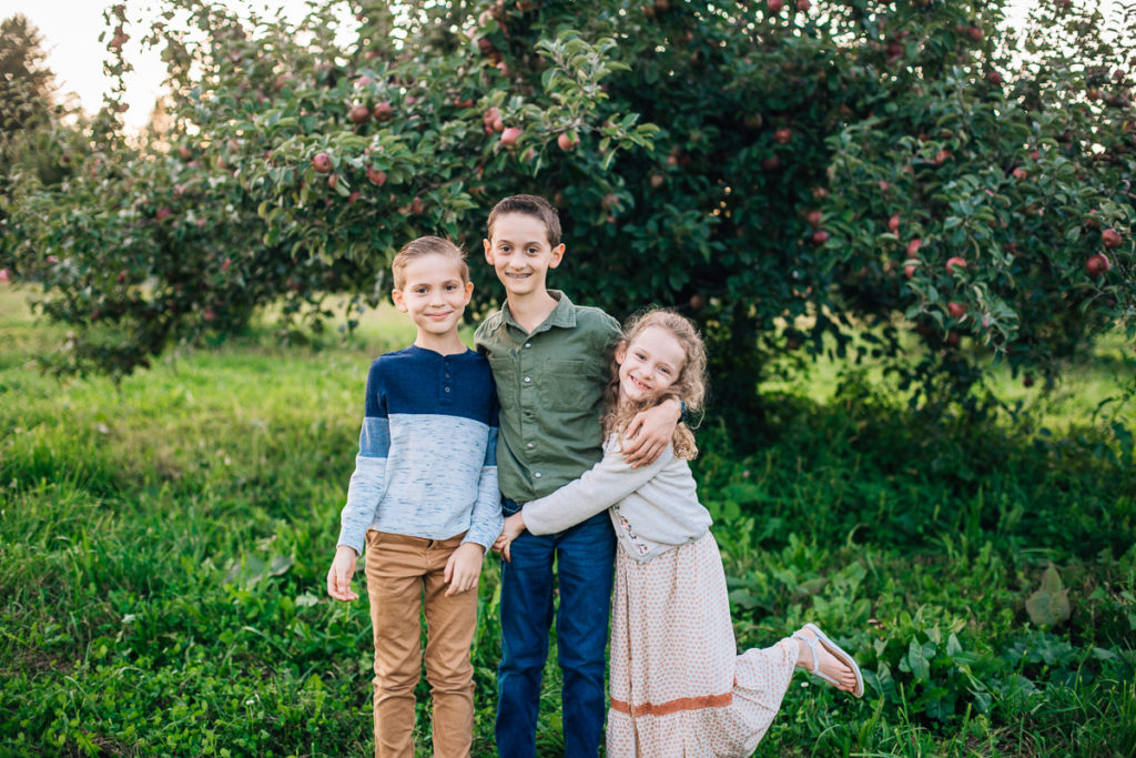 three siblings at apple orchard in Clifton Park NY