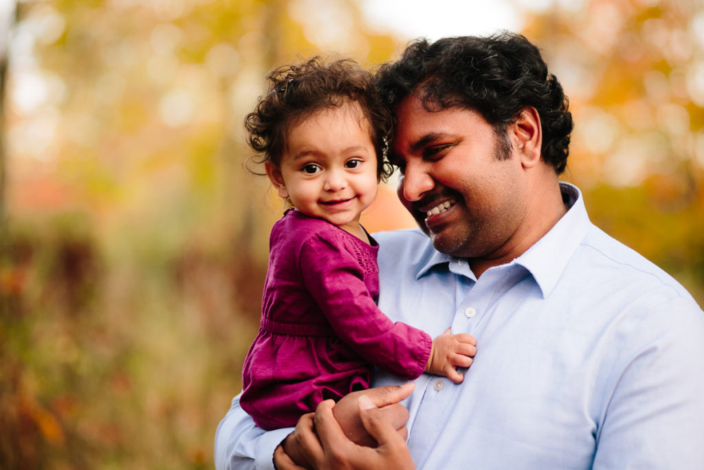 Dad holding baby daughter